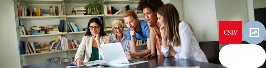 People are having a meeting togther in front of a computer screen