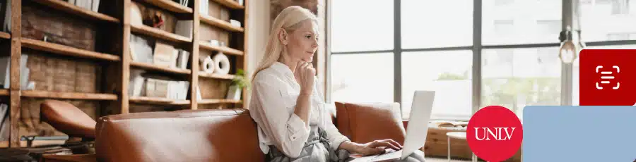 reading in her computer and learning about Navigating the CompTIA Landscape in Las Vegas