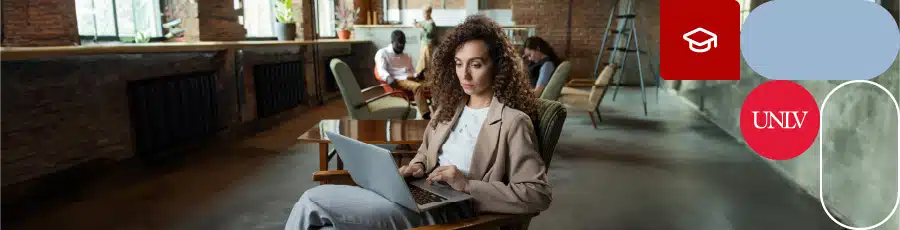 Working on her laptop reading about Nevada's Flourishing Cybersecurity Landscape